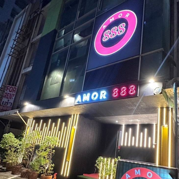 Amor 888 at night: the black front on Sukhumvit Soi 18 with the lit 888 sign and light strips either side of the entrance